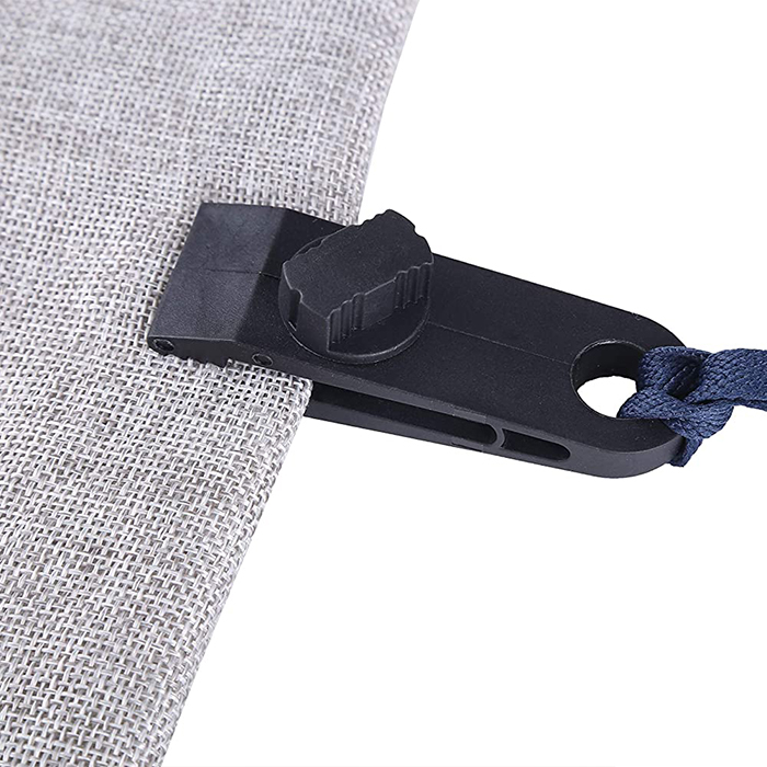 The vise is quick and easy to install using a pin that you tighten to compress the side of the tent. You then tie a rope to the end of the vise and fix the tent with a cleat.